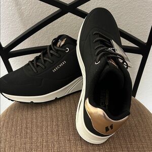 Skechers Black Sneakers with Gold Highlights